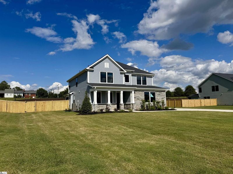 Front exterior of a new home in Double Springs, Taylors, SC, highlighting curb appeal (Image 1).