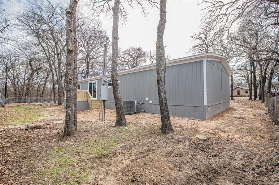View of home's exterior featuring central air condition unit View of home's exterior featuring central air condition unit