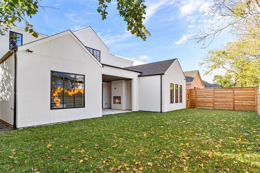 Back of house featuring a patio area, stucco siding, and a fenced backyard Back of house featuring a patio area, stucco siding, and a fenced backyard