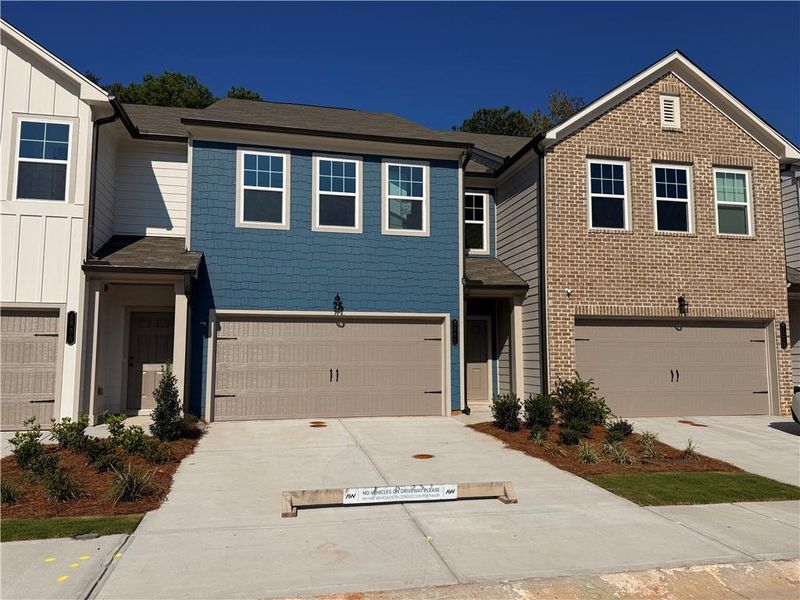 Front exterior of a new home in Laurelwood, Douglasville, GA, highlighting curb appeal (Image 26).