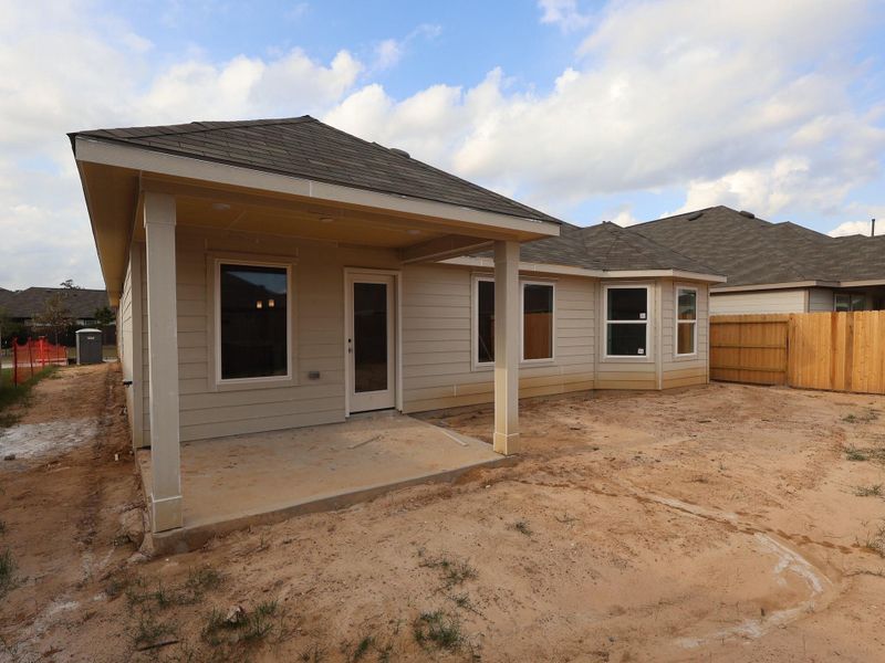 Exterior details and patio area of a home in Pinewood at Grand Texas, New Caney (Image 3). Exterior details and patio area of a home in Pinewood at Grand Texas, New Caney (Image 3).