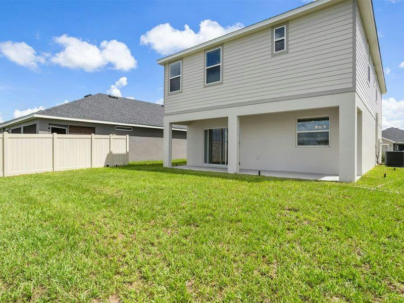 A nice-sized yard and large lanai provide desirable outdoor living space.