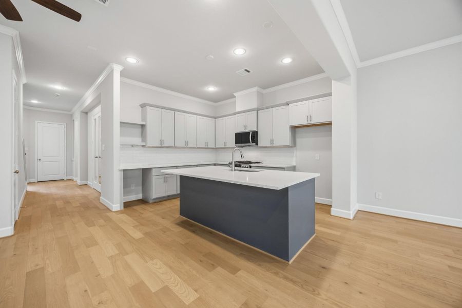 Whether you’re prepping dinner or pouring wine for friends, this oversized island is the hub of the home—anchoring the kitchen, dining, and living areas with ease and elegance.