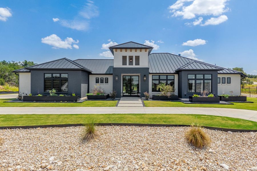 Clean lines and a standing-seam metal roof define this striking modern exterior architecture.