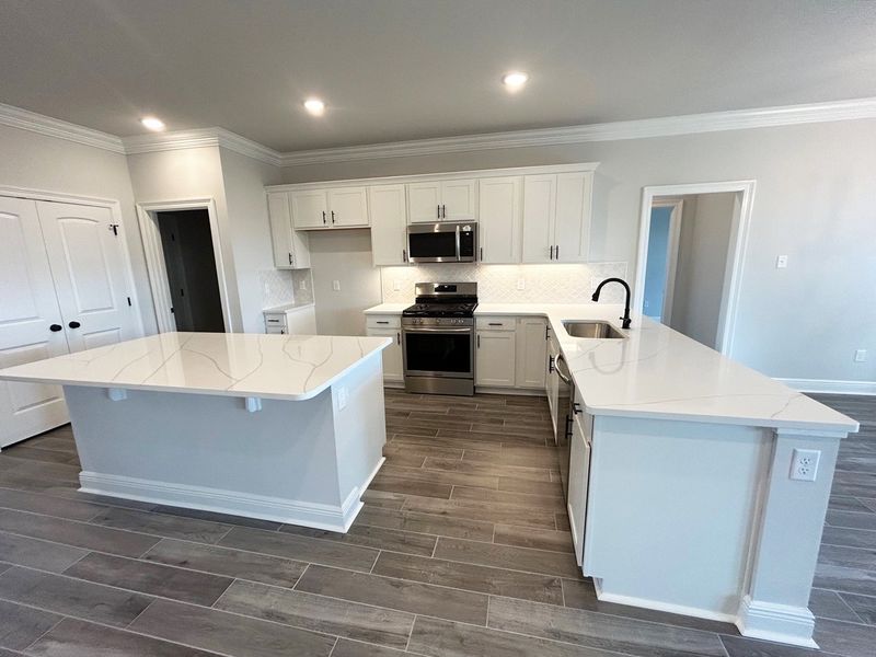 Furnished interior view inside a new home in The Bluffs at Lafayette, Freeport (Image 4).