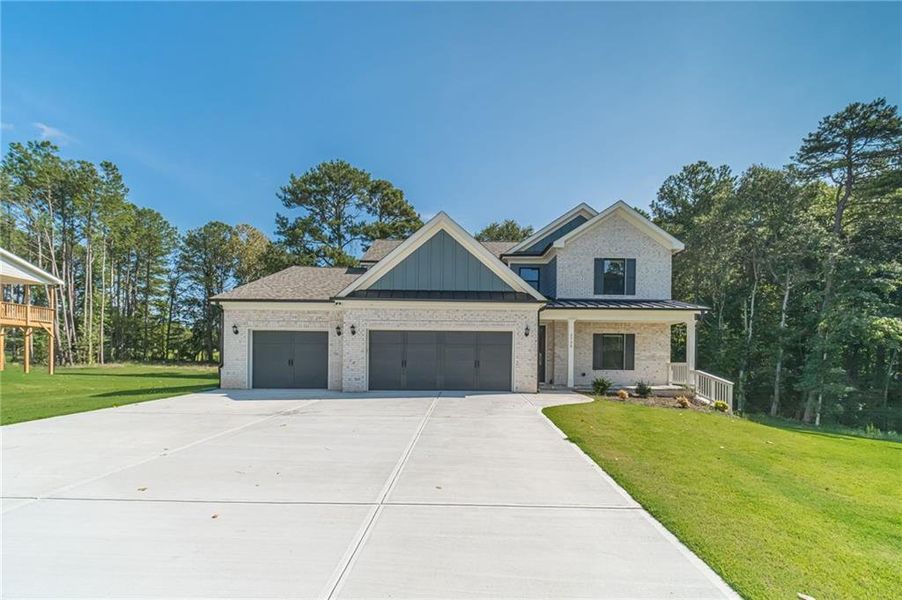 Front exterior of a new home in , Loganville, GA, highlighting curb appeal (Image 26).