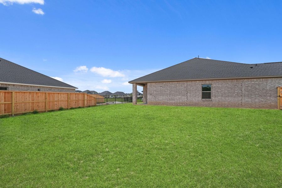 Exterior details and patio area of a home in Laurel Landing, Alvin (Image 21). Exterior details and patio area of a home in Laurel Landing, Alvin (Image 21).
