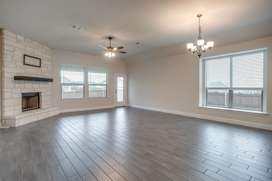 Living room open to breakfast area and kitchen