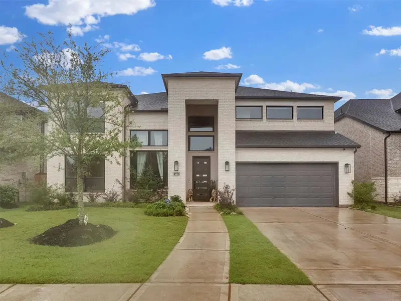 Front exterior of a new home in , Richmond, TX, highlighting curb appeal (Image 1). Front exterior of a new home in , Richmond, TX, highlighting curb appeal (Image 1).
