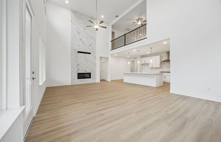 Gathering room with view of main living areas *Model Representation*