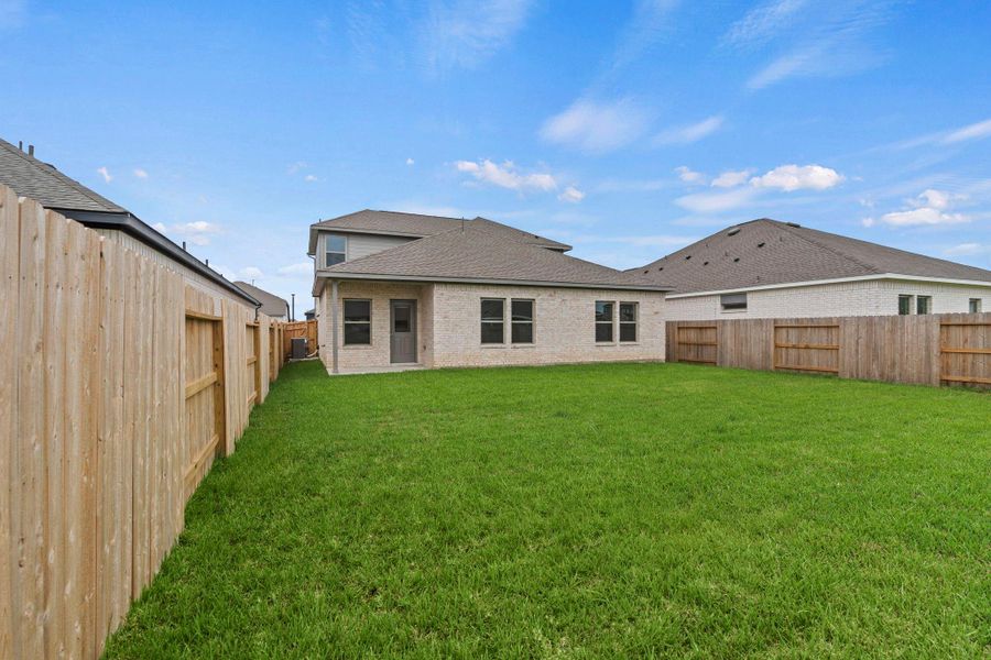 Exterior details and patio area of a home in Windrose Green, Angleton (Image 4).