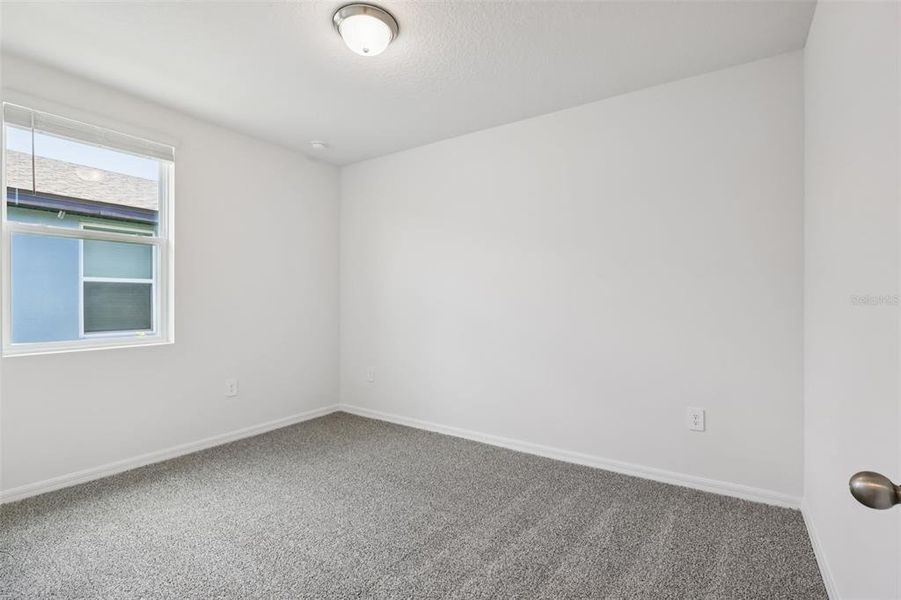 Spacious, unfurnished interior of a new home in Lake Deer Estates - Signature Series, Poinciana (Image 19).