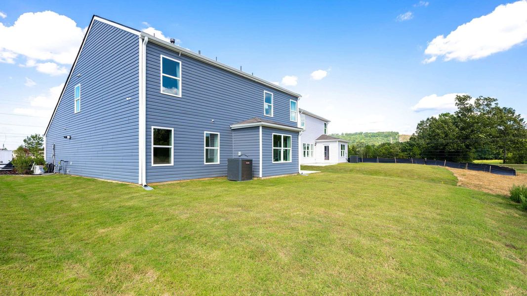 Front exterior of a new home in Hawk's Ridge, Rossville, GA, highlighting curb appeal (Image 19).