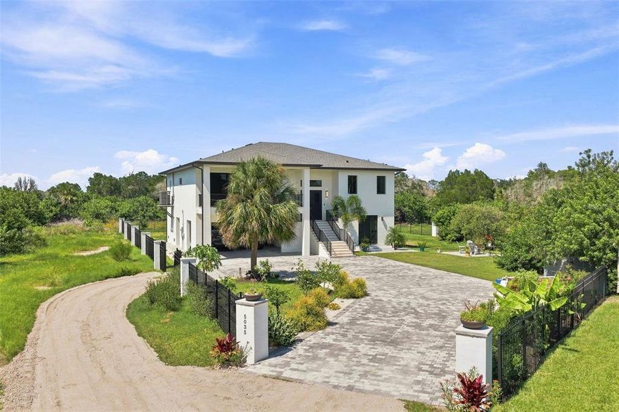 Front exterior of a new home in , Port Richey, FL, highlighting curb appeal (Image 24).