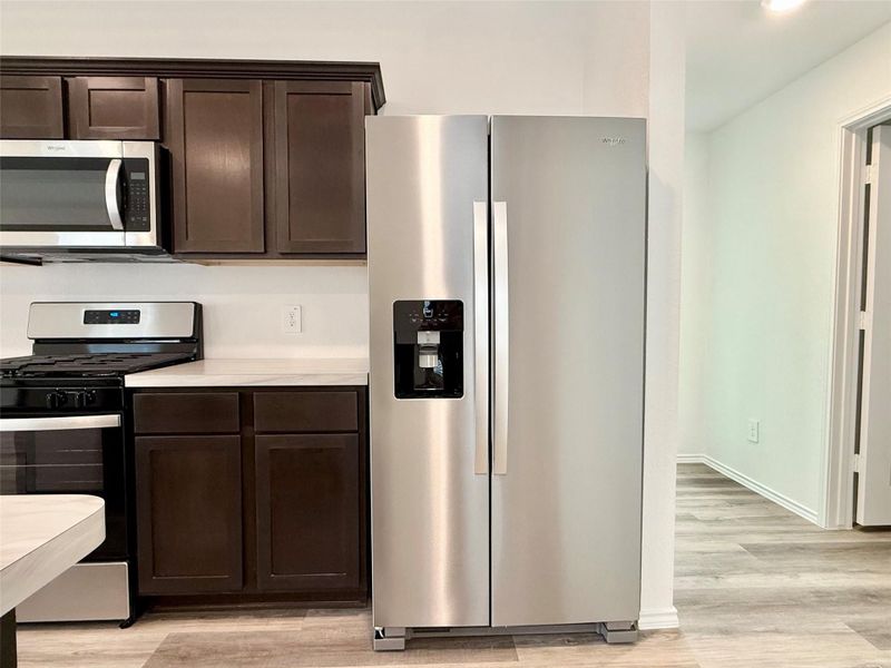 All stainless steel appliances convey with the sale.