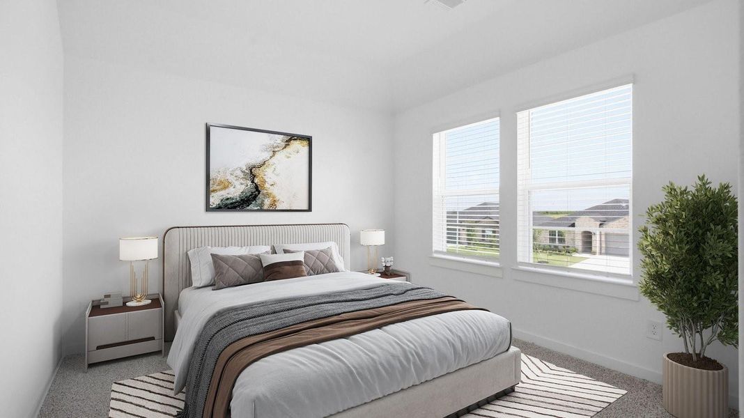 A spacious primary bedroom emphasizing open space and natural lighting with large windows.