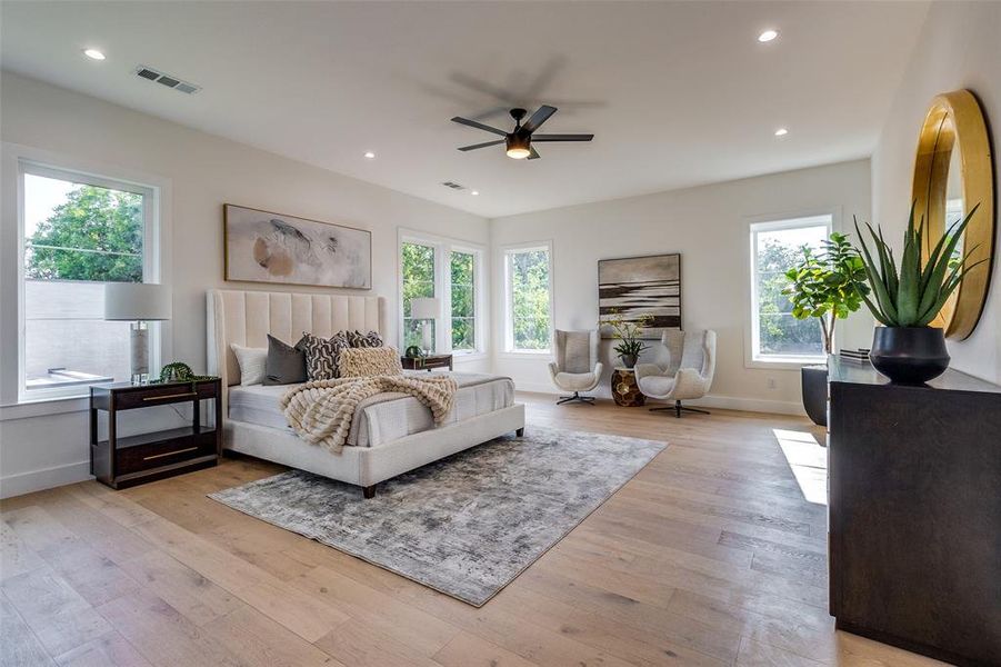 Bedroom featuring ceiling fan and light wood-type flooring