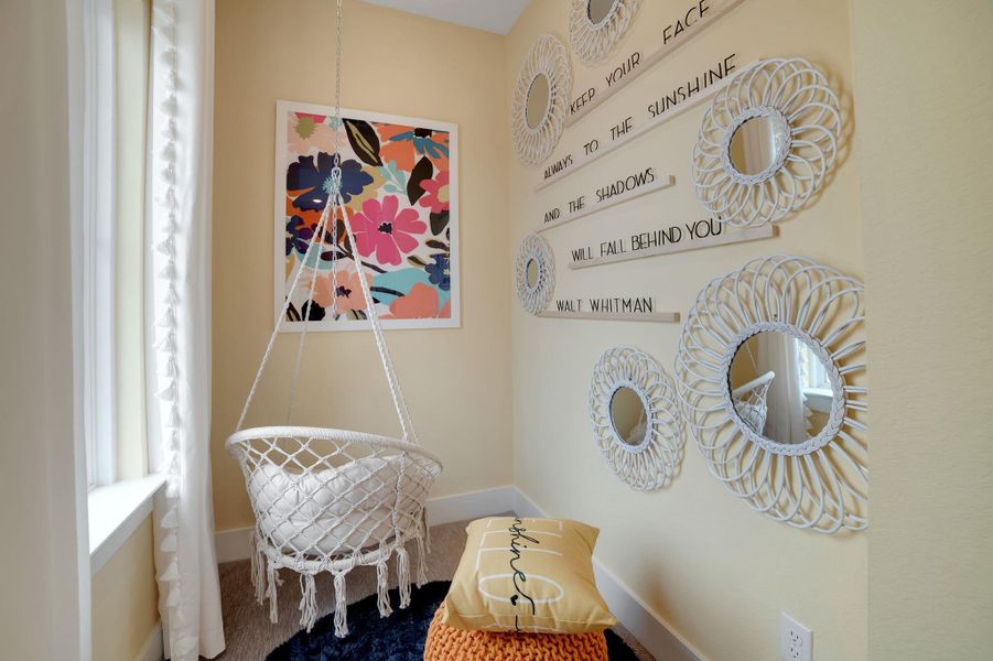 Sitting room featuring baseboards