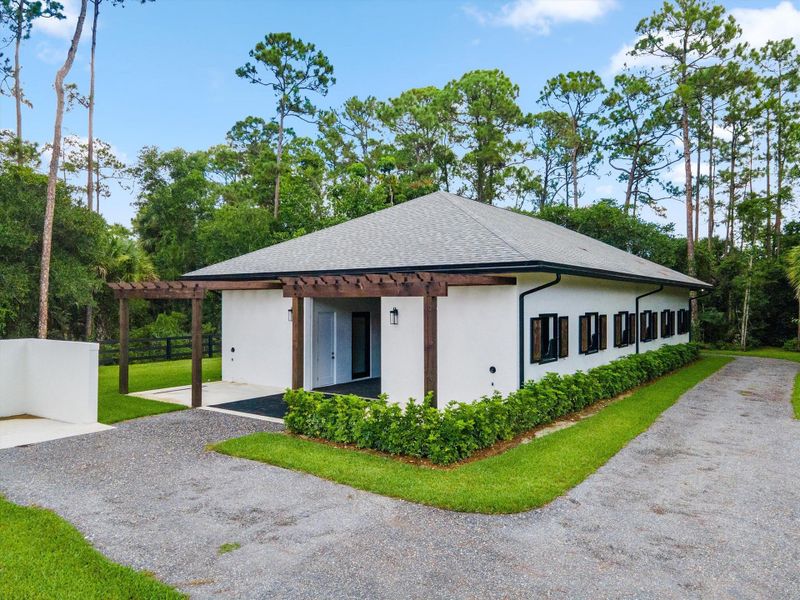Front exterior of a new home in , Wellington, FL, highlighting curb appeal (Image 26).