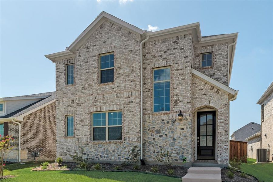 Front exterior of a new home in Arbors at Legacy Hills, Celina, TX, highlighting curb appeal (Image 14). Front exterior of a new home in Arbors at Legacy Hills, Celina, TX, highlighting curb appeal (Image 14).
