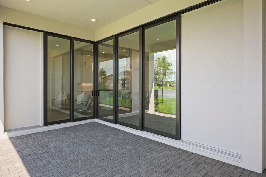 Exterior details and patio area of a home in Cresswind Palm Beach at Westlake, The Acreage (Image 30).