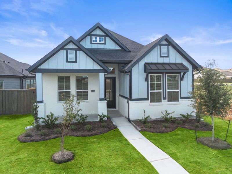 Front exterior of a new home in Riceland, Mont Belvieu, TX, highlighting curb appeal (Image 18). Front exterior of a new home in Riceland, Mont Belvieu, TX, highlighting curb appeal (Image 18).