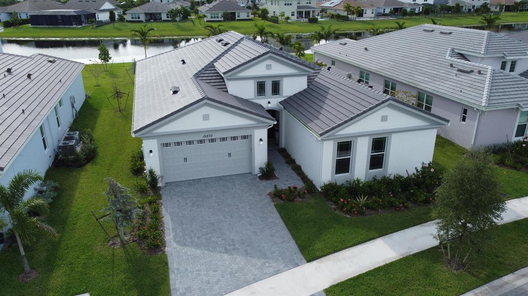 Front exterior of a new home in Westlake, Loxahatchee, FL, highlighting curb appeal (Image 2).