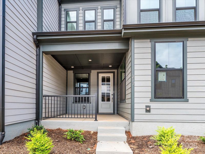 Charming Covered Front Porch Ideal for Morning Coffees or Cozy Nights.
