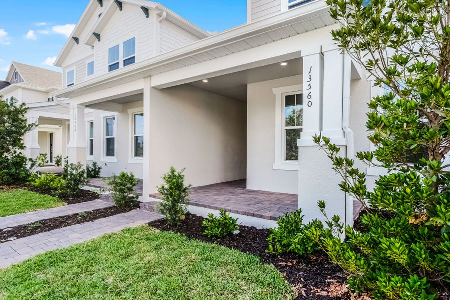 Representative exterior details of a home built from the Newton by Rockwell Homes in Harvest at Ovation - Townhomes, Winter Garden (Image 44). Representative exterior details of a home built from the Newton by Rockwell Homes in Harvest at Ovation - Townhomes, Winter Garden (Image 44).
