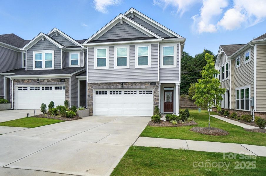 Front exterior of a new home in Porter's Row, Charlotte, NC, highlighting curb appeal (Image 2). Front exterior of a new home in Porter's Row, Charlotte, NC, highlighting curb appeal (Image 2).