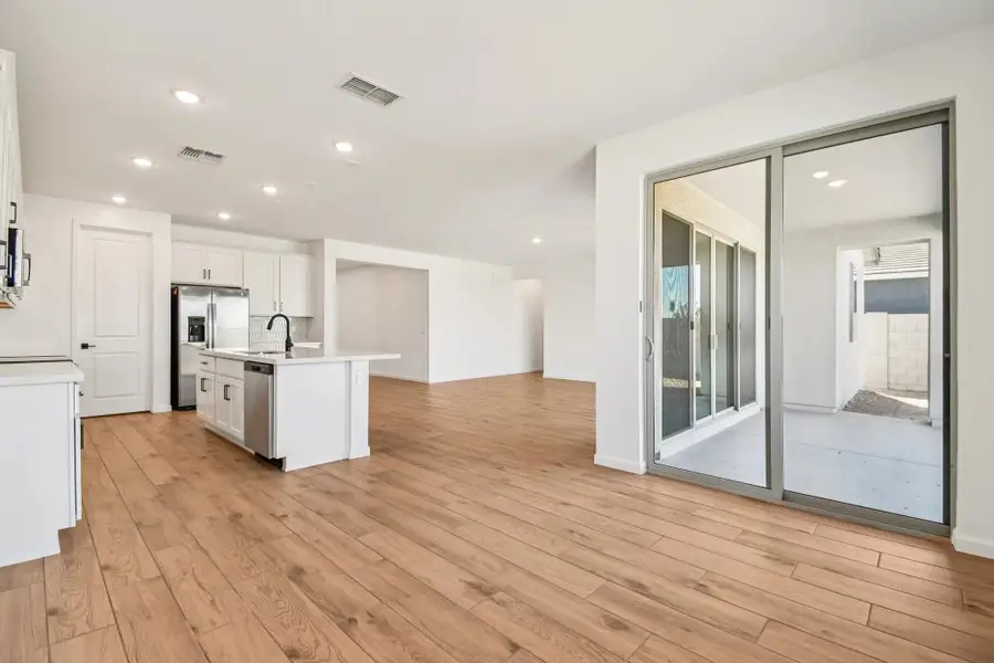 Dining into kitchen and great room. Not actual home, finishes and options may vary. Dining into kitchen and great room. Not actual home, finishes and options may vary.