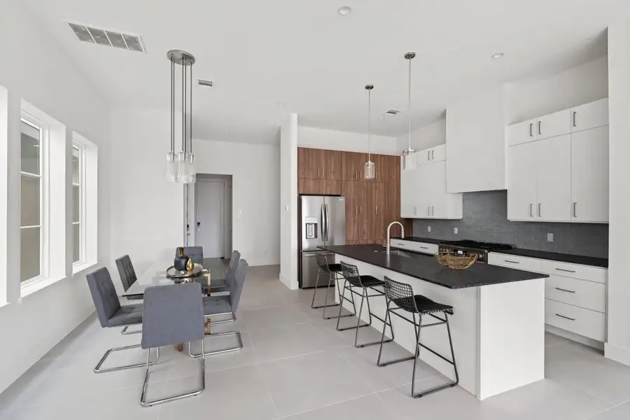 With soaring ceilings, expansive windows, and sleek tile flooring, this space is as stylish as it is functional. With soaring ceilings, expansive windows, and sleek tile flooring, this space is as stylish as it is functional.