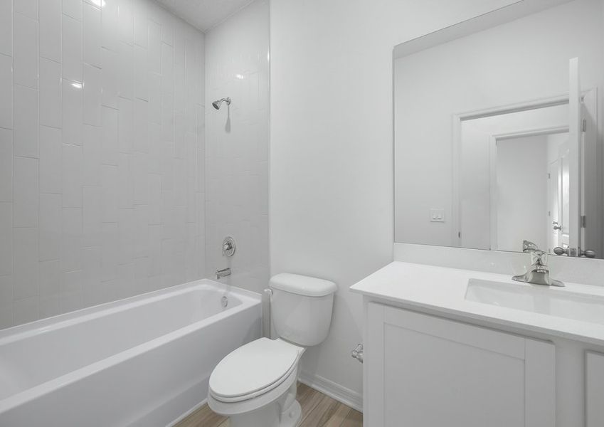 The secondary bathroom with shower tub combo