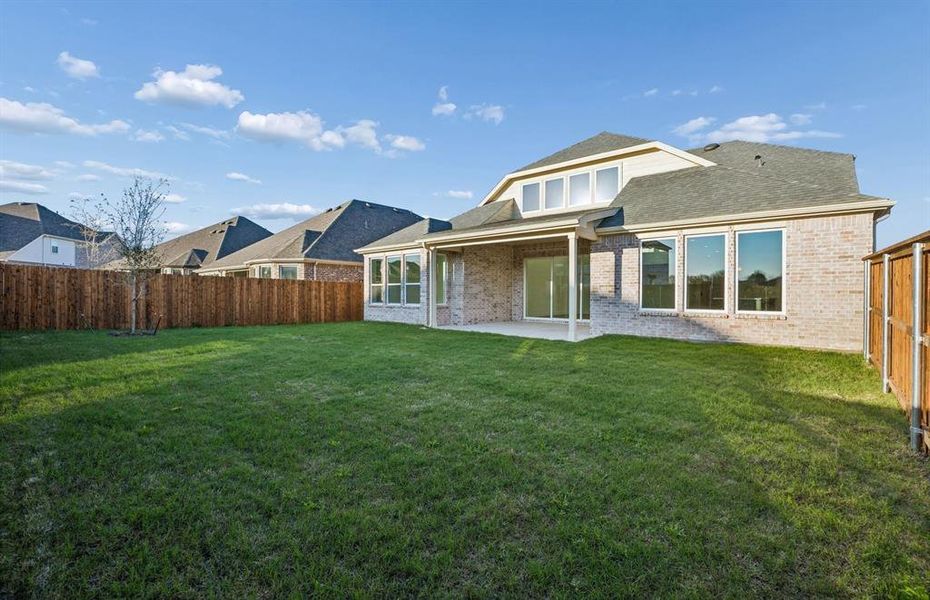 Spacious, fenced-in backyard with covered patio Spacious, fenced-in backyard with covered patio
