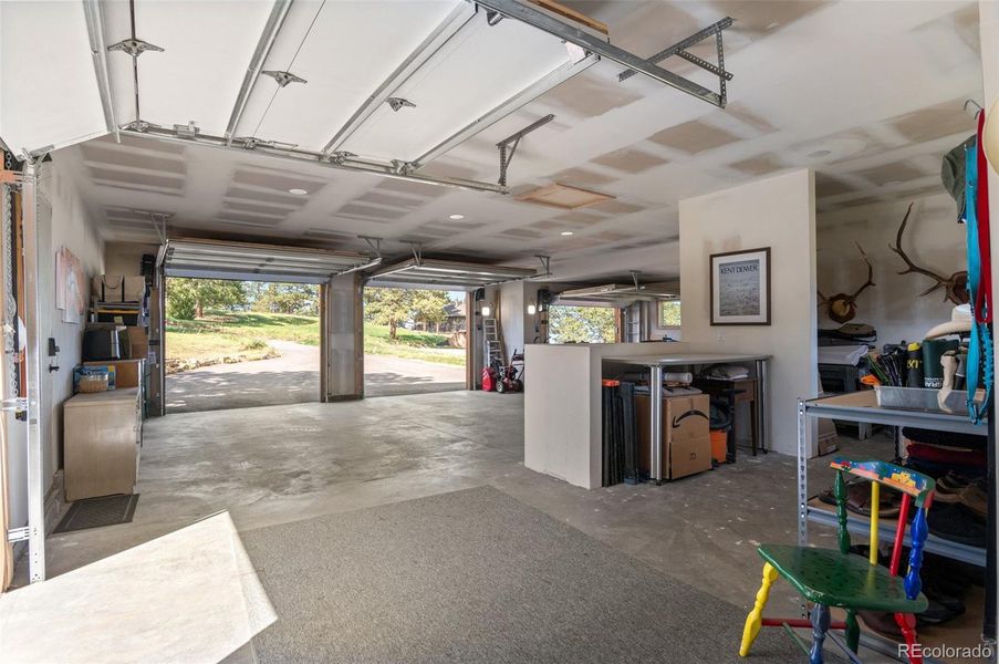 Workshop in the massive 3-car garage. Walls and ceilings are drywalled, taped, & sanded - ready for paint if you want to dress up this area
