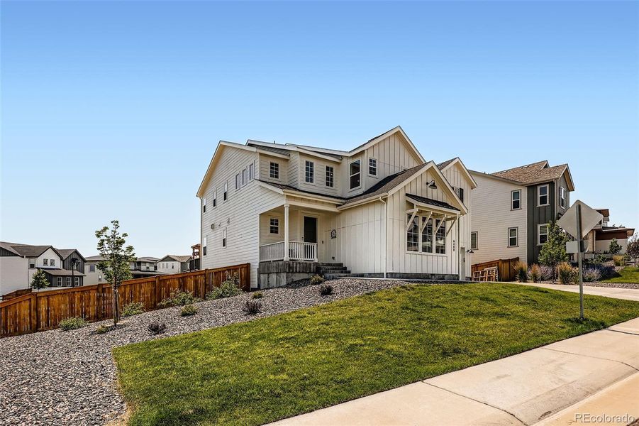 Front exterior of a new home in , Castle Pines, CO, highlighting curb appeal (Image 18).