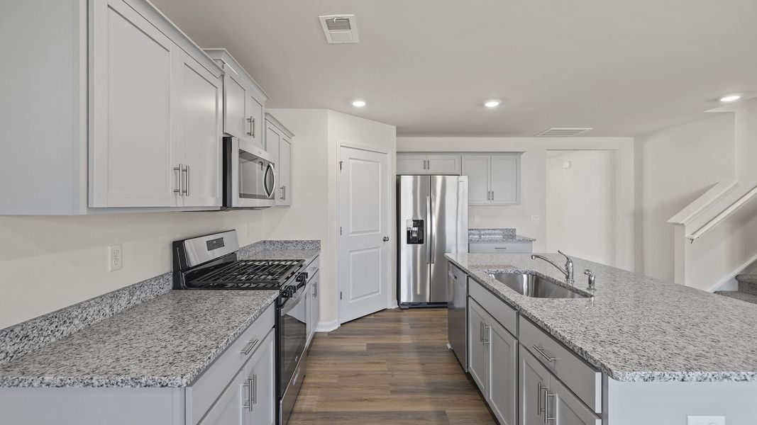 Furnished interior view inside a new home in Bentley Park, Greenwood (Image 9).