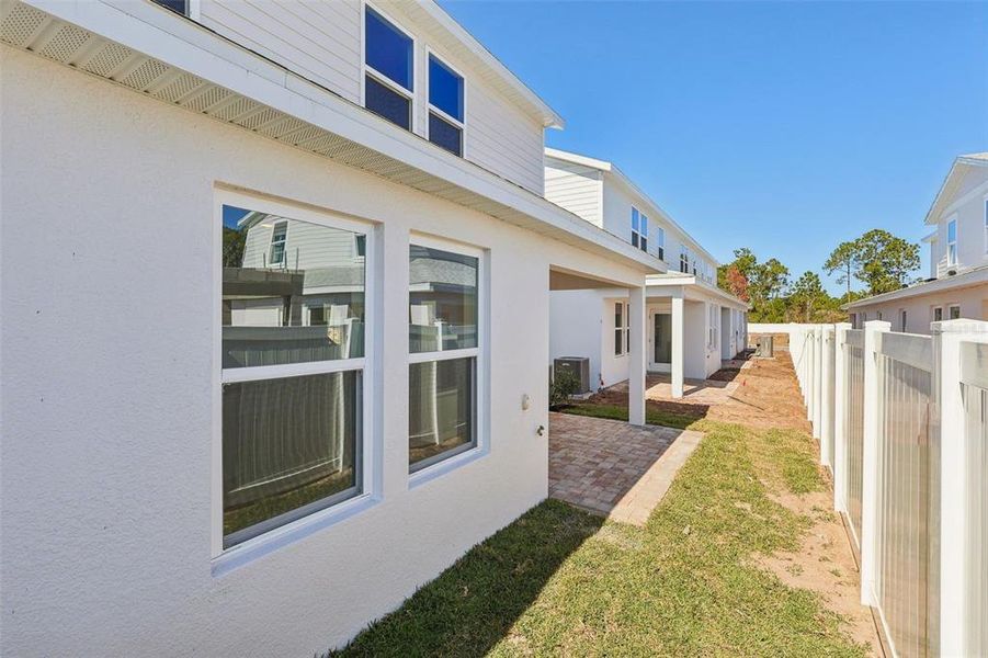 Exterior details and patio area of a home in Cyrene at Harmony, St. Cloud (Image 22).