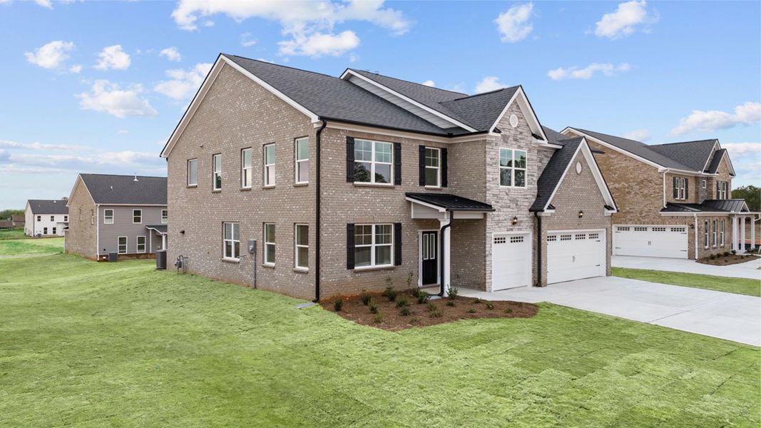 Front exterior of a new home in The Gates at Pates Creek, Hampton, GA, highlighting curb appeal (Image 2).