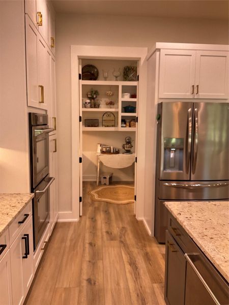 Kitchen features Z-Line appliances double oven, built-in island microwave, 6 burner gas cooktop and tons of storage