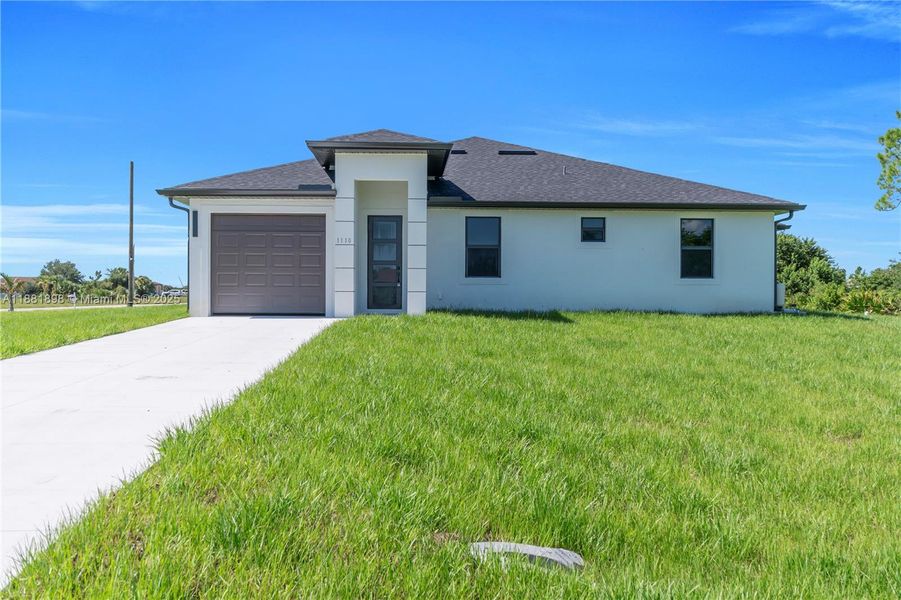 Front exterior of a new home in , Lehigh Acres, FL, highlighting curb appeal (Image 18).