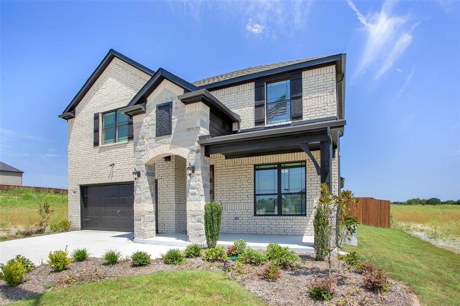 View of front of property featuring a garage