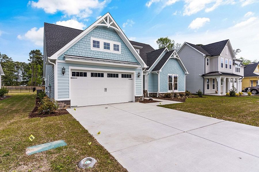 Representative exterior photo of a completed home built from the The Bradley by RobuckHomes in Windwater, Hampstead, NC (Image 27).