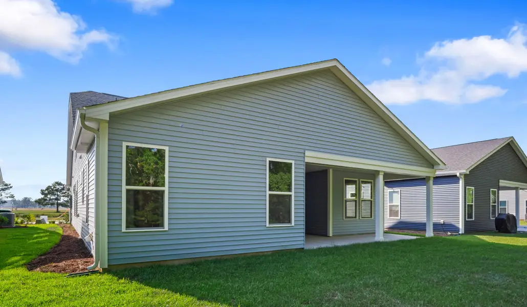 Exterior details and patio area of a home in Coastal Club of the Carolinas, Calabash (Image 3).