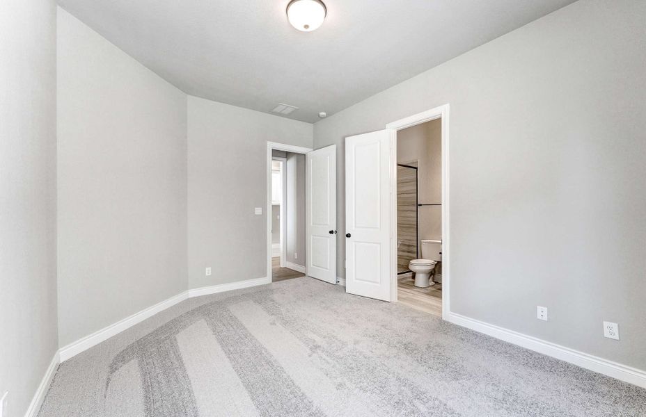 Representative unfurnished interior of a home built from the 2870 by Ravenna Homes in The Woodlands Hills 65′, Willis (Image 38). Representative unfurnished interior of a home built from the 2870 by Ravenna Homes in The Woodlands Hills 65′, Willis (Image 38).