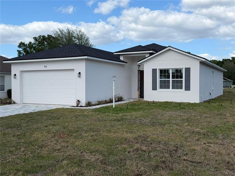 Front exterior of a new home in , Beverly Hills, FL, highlighting curb appeal (Image 2). Front exterior of a new home in , Beverly Hills, FL, highlighting curb appeal (Image 2).
