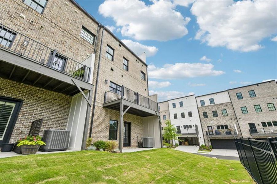 Exterior details and patio area of a home in Skyview On Broad, Sugar Hill (Image 3).