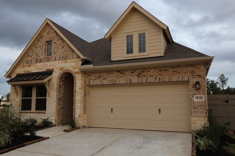 Front exterior of a new home in ARTAVIA 45' Homesites, Conroe, TX, highlighting curb appeal (Image 1). Front exterior of a new home in ARTAVIA 45' Homesites, Conroe, TX, highlighting curb appeal (Image 1).