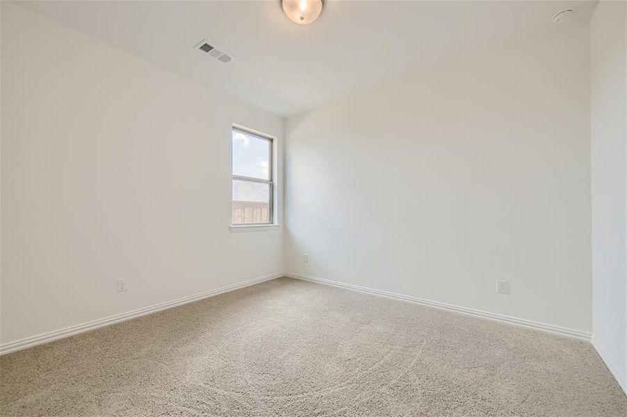 Unfurnished room with carpet flooring