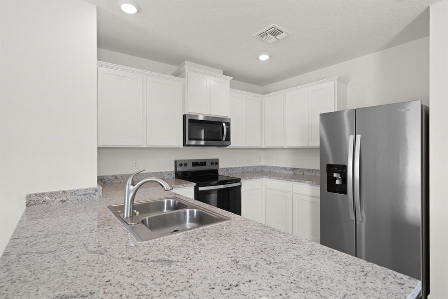 Furnished interior view inside a new home in Central Park 40s, Port St. Lucie (Image 9).